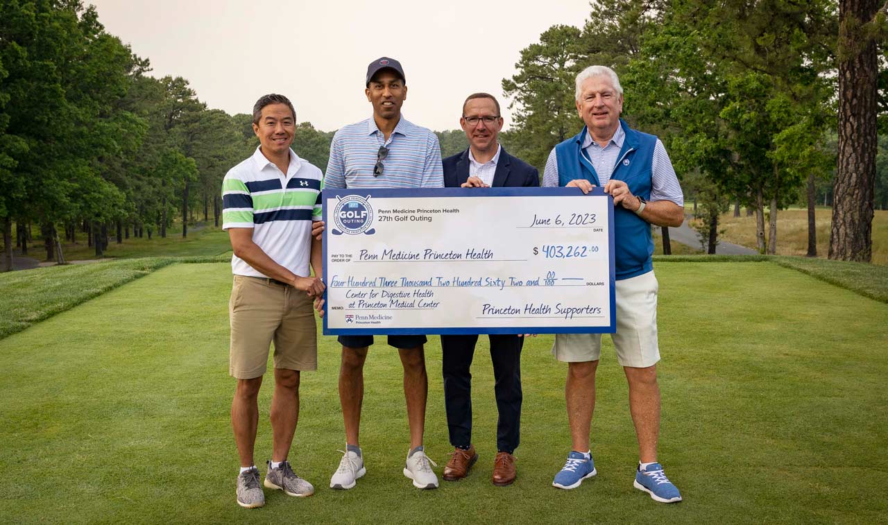 Foundation Golf 2023 members with big check