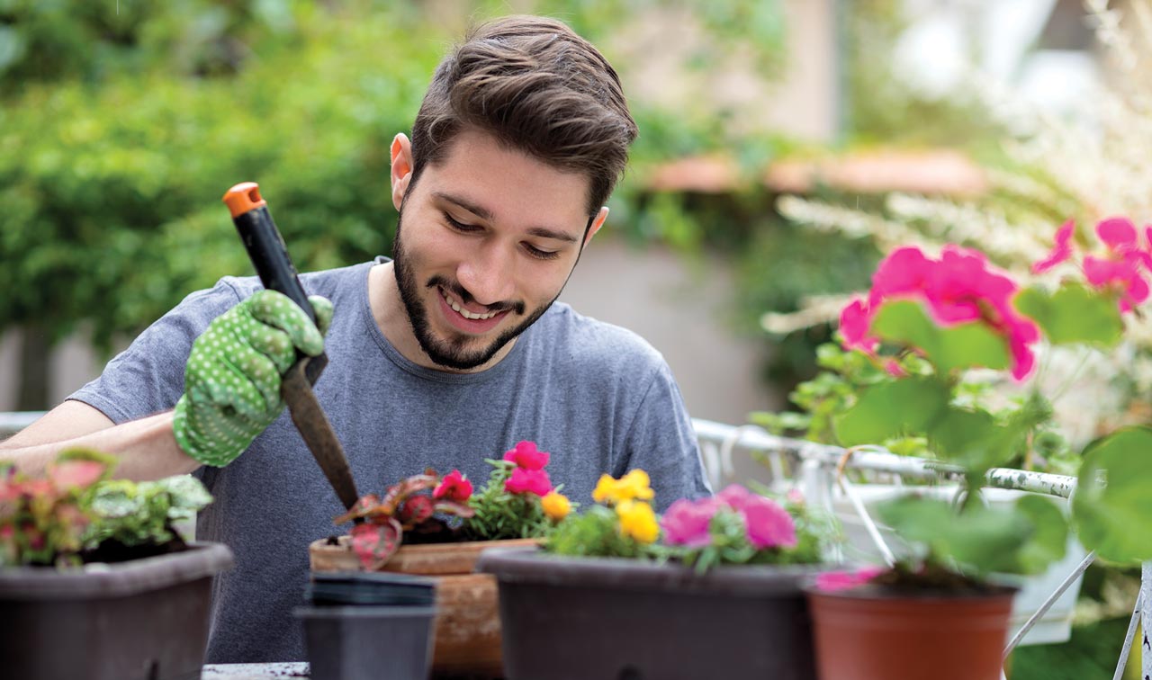 Man planting flowers