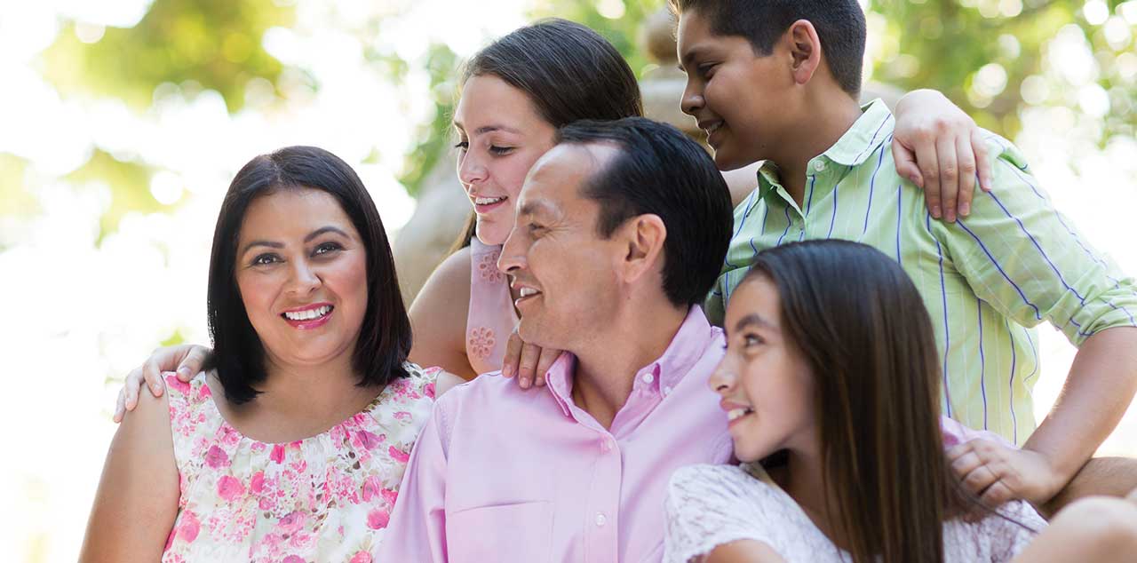 Photo of happy family around the mother