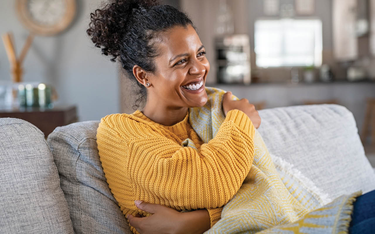 Image of woman hugging herself