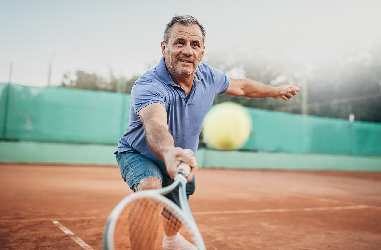 photo of man playing tennis