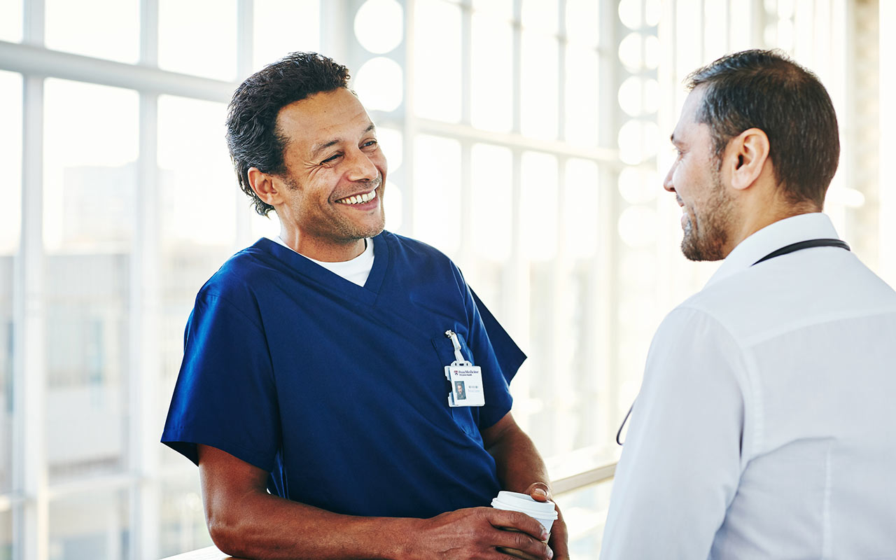 Image of two doctors having a conversation