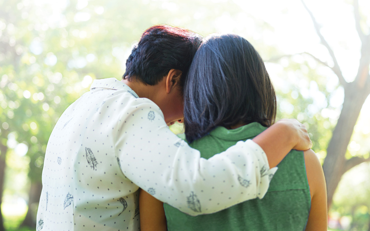 Photo of woman comforting daughter