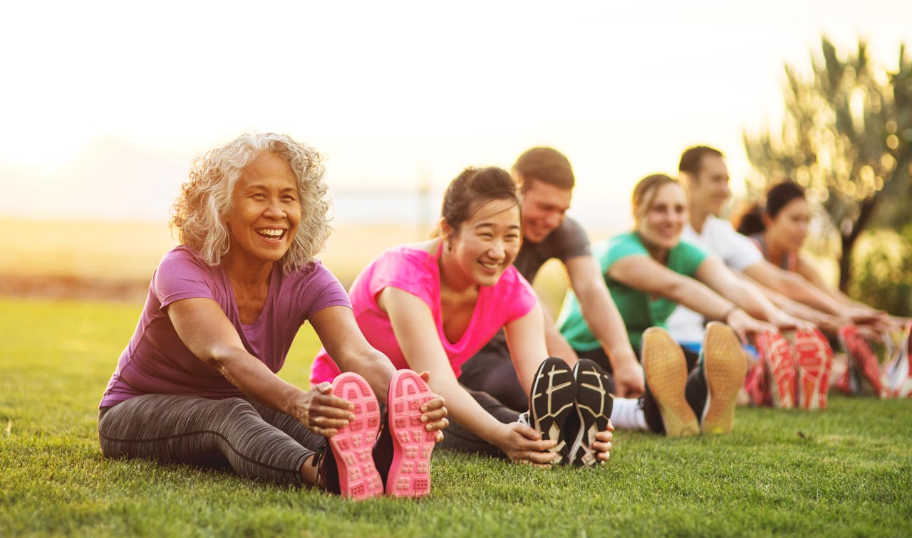 Photo of adults exercising outdoors