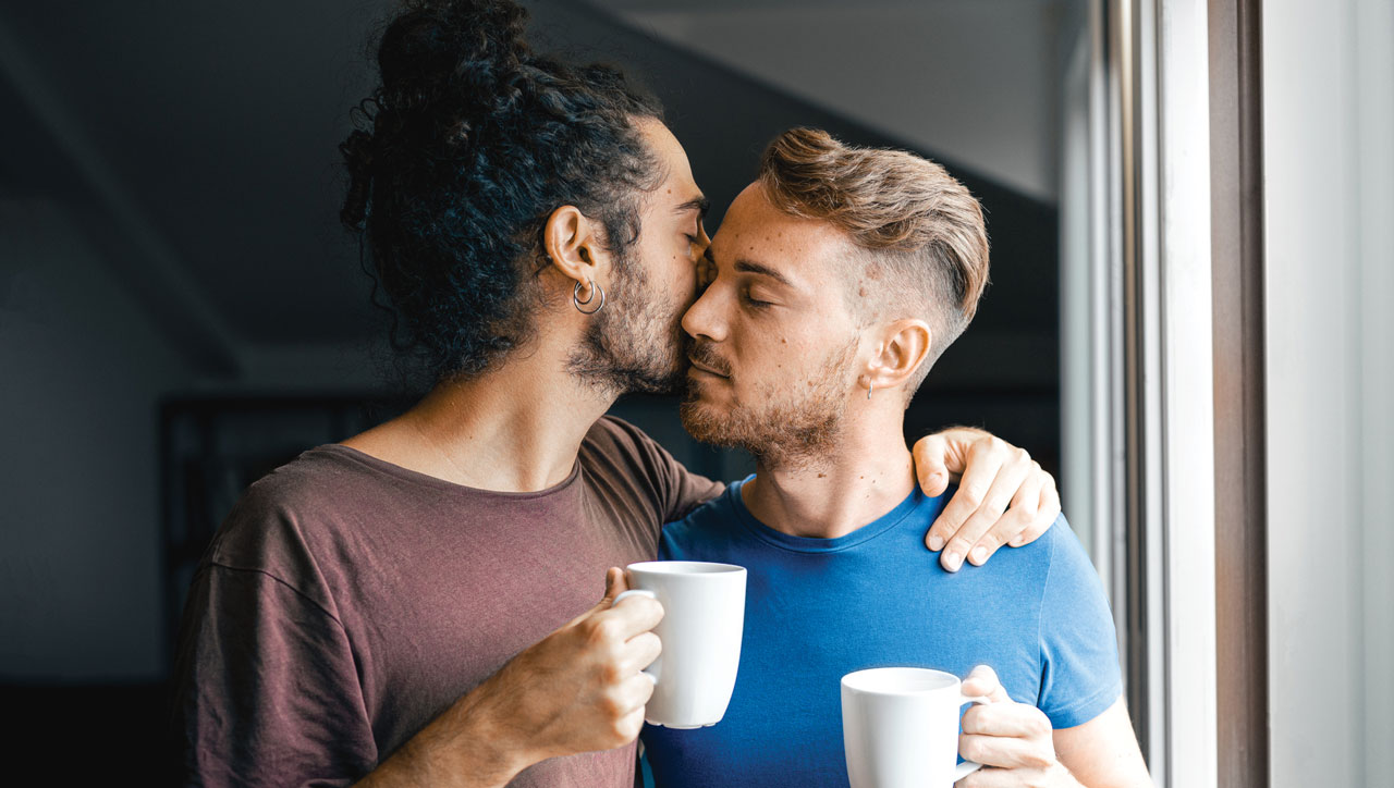 photo of male couple kissing