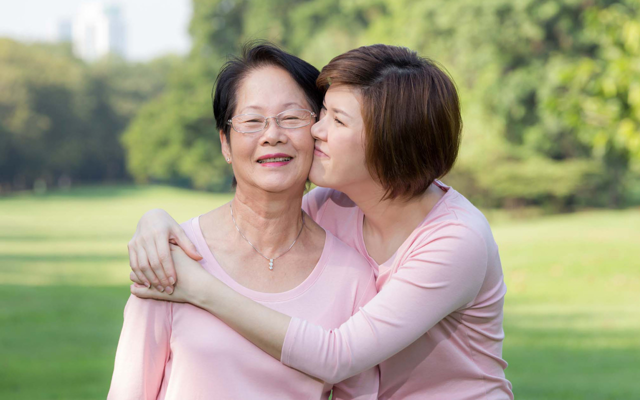 Photo of senior woman and daughter hugging