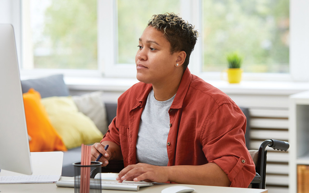 Image of woman looking at computer