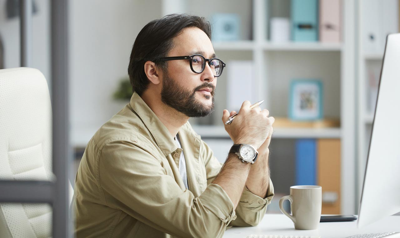 Photo of man looking pensive