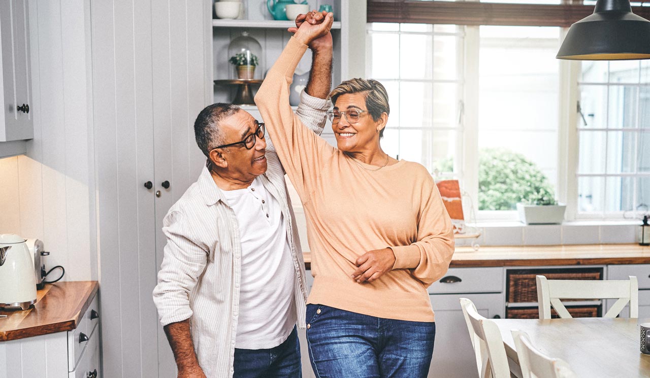 Photo of couple dancing at home