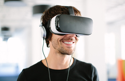 Image of adult wearing VR goggles